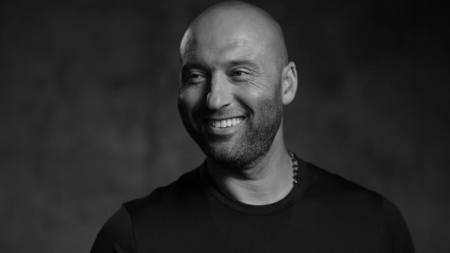 Derek Jeter smiles in photo shoot.